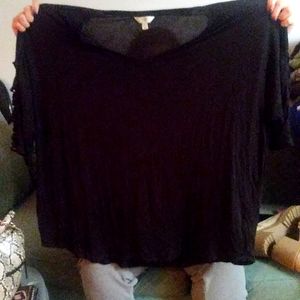 Black 3/4 length sleeve shirt with criss crossed sleeves